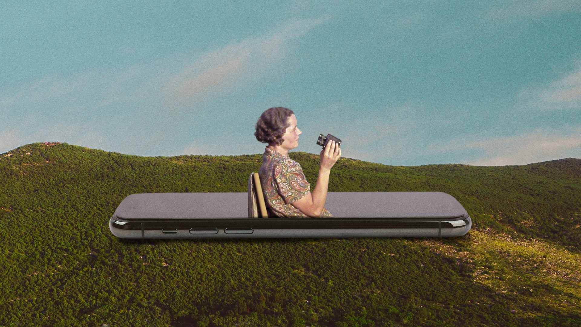 A woman coming out of a phone with binoculars in a landscape