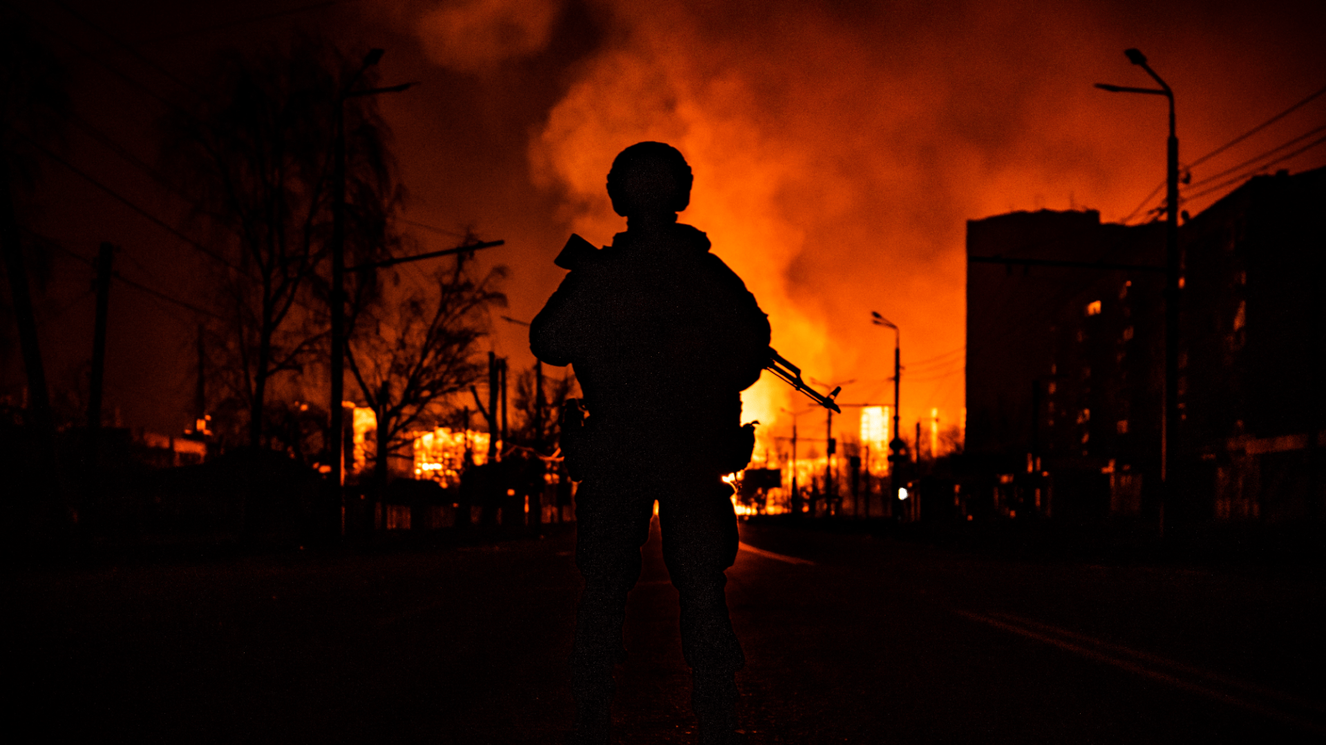 Soldier in front fire in Ukraine-Russia conflict.