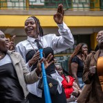 Young attendees dance and sing on church grounds in the Kibera informal settlement of Nairobi.